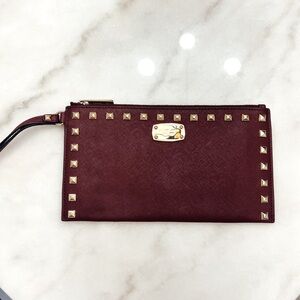 Michael Kors maroon wallet / wristlet with gold studs